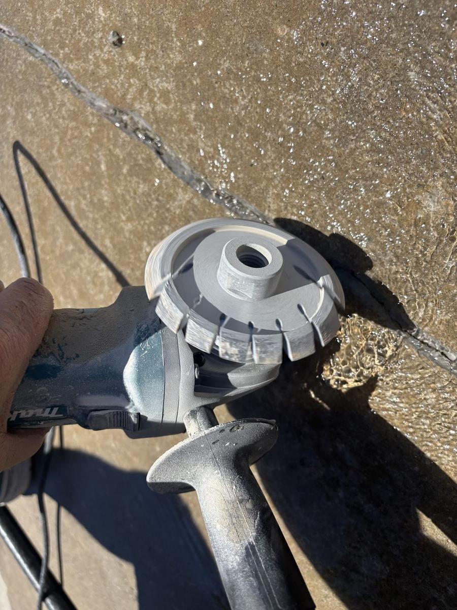Grinding a crack before coating