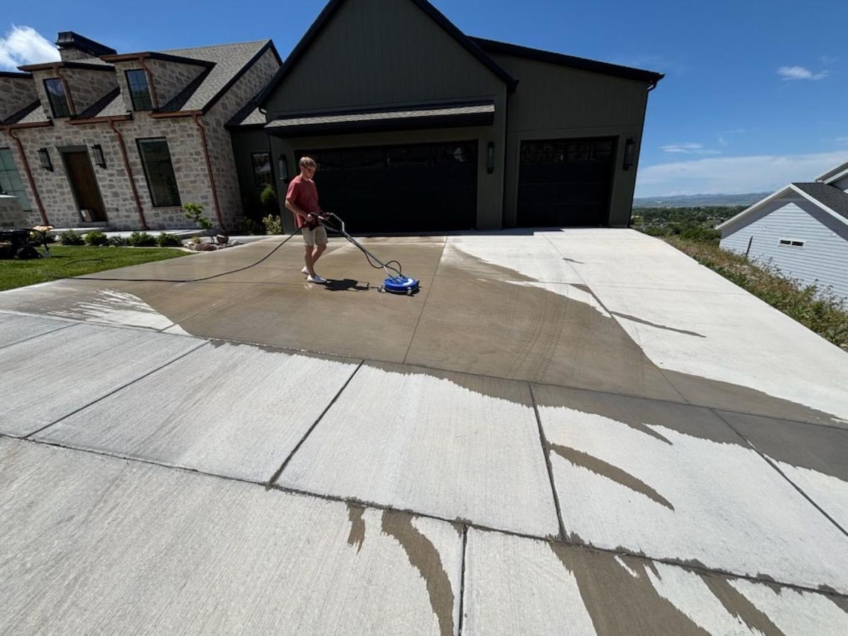 Pressure washing a driveway